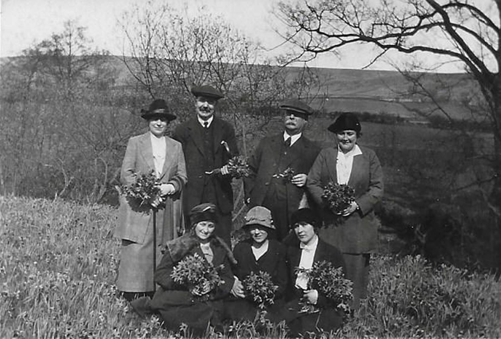 A black and white photo of a couple of people
Description automatically generated
